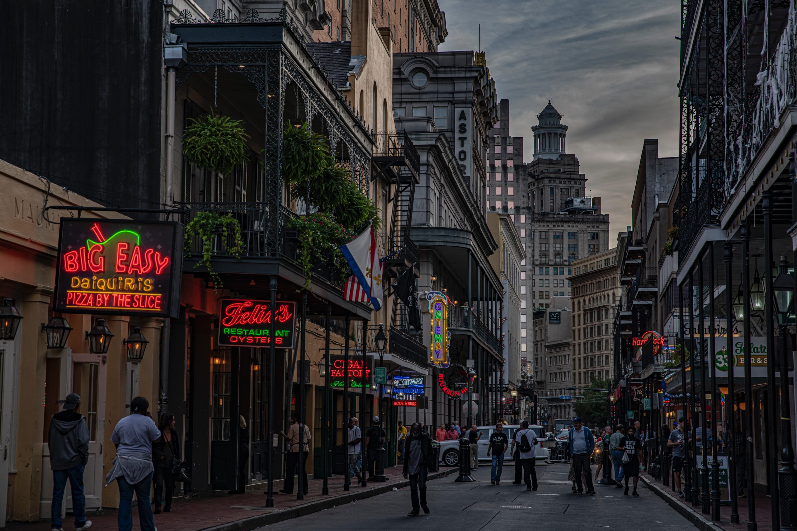 An evening view of a busy Bourbon Street in New Orleans