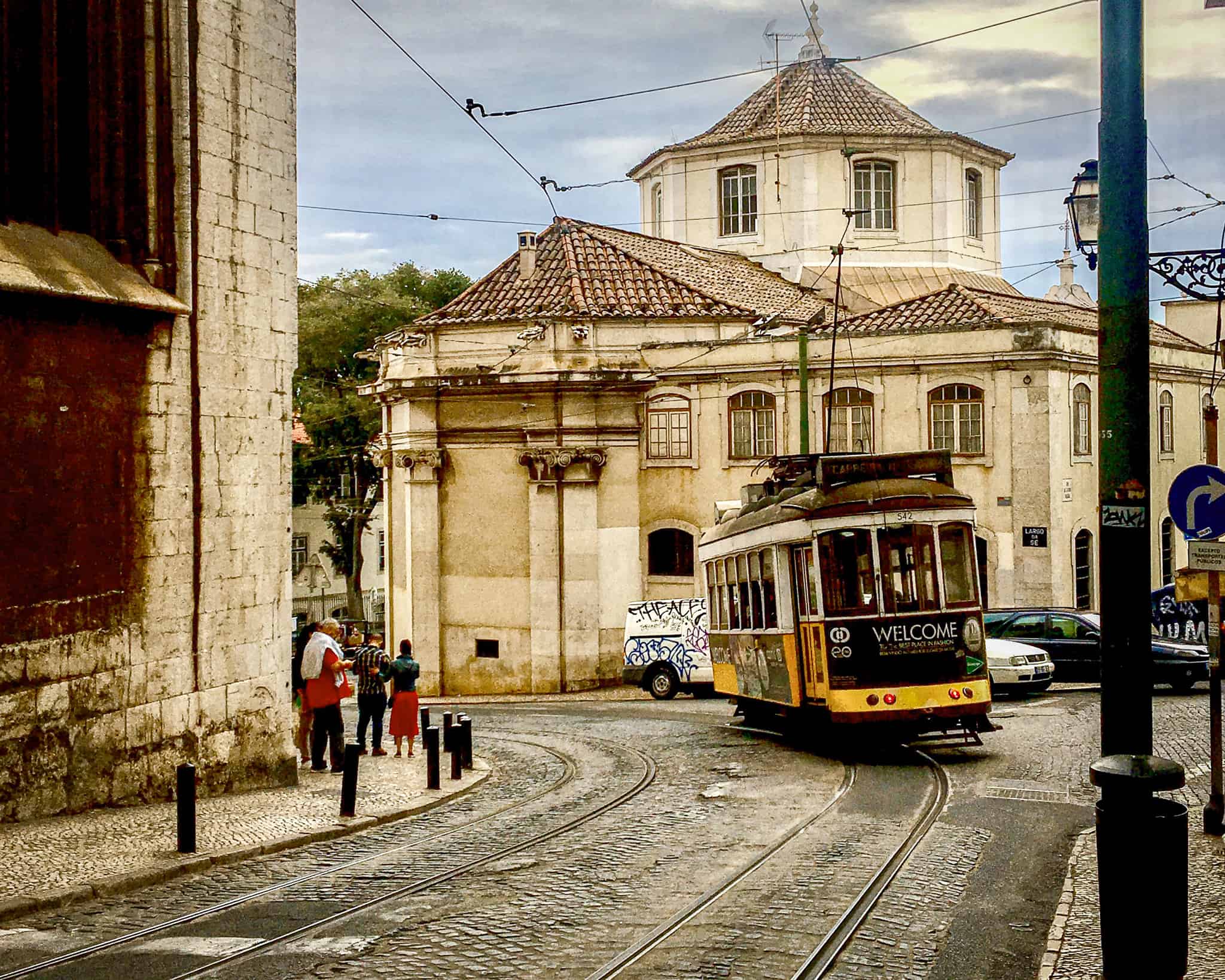 A streetcar rolls by in Lisbon, Portugal.